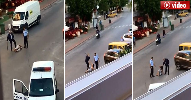 Yerde yatan kadını tekmeleyen polis tutuklandı