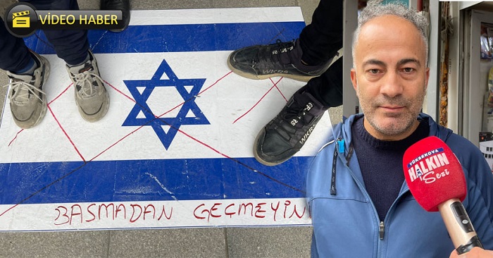 Hakkari'de bir esnaf,  İsrail bayraklarını Kaldırıma serdi